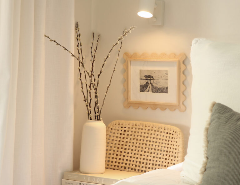 Maple 8x10 scalloped frame with a black-and-white photo above a cane chair
