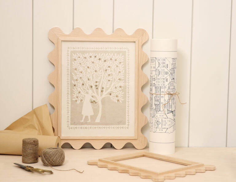 Maple 11x14 scalloped frame with a tree print, styled with craft supplies