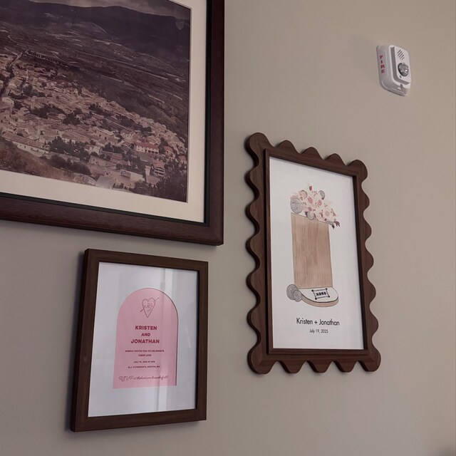 Customer photo of walnut Elise scallop frames on a wall