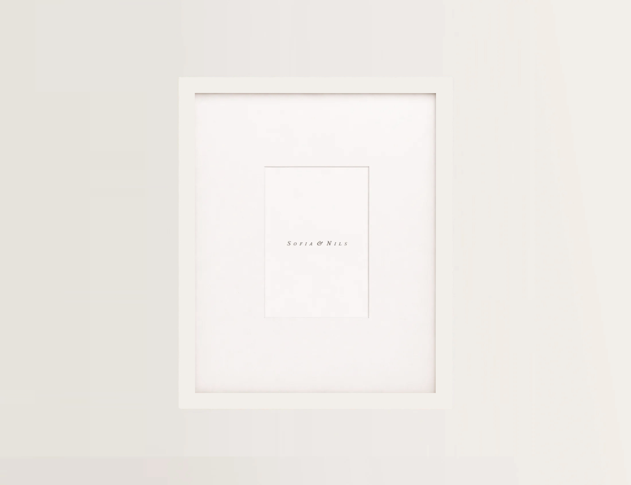 Custom-cut white mat board with a centered opening, by Sofia & Nils